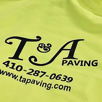 A safety yellow hoodie screen printed in black for T&A Paving