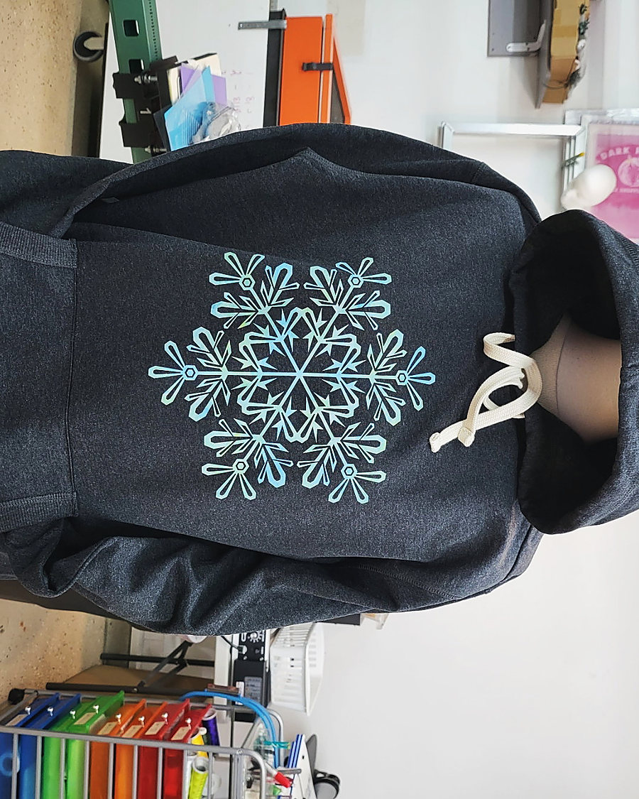 A drawstring bag with a sparkle snowflake