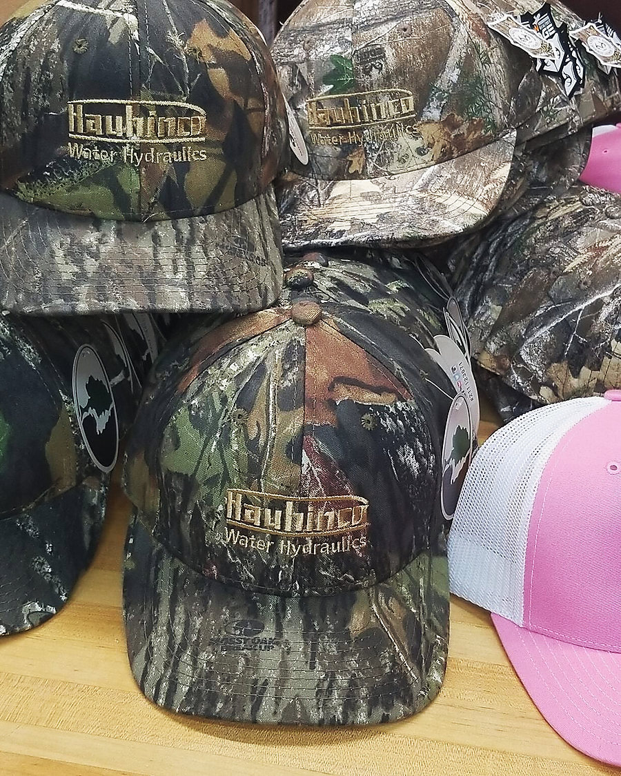 Camo and pink caps with embroidered patches